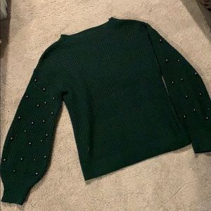 Knit sweater with beaded arms